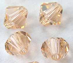  swarovski 5328 light peach 6mm bicone bead 
