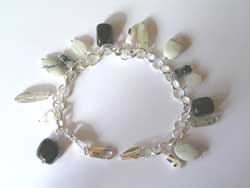  bracelet- onyx - moonstone - snowflake obsidian - white shell - howlite - all set in sterling silver hallmarked by the london assay office 