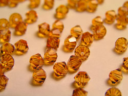  swarovski 5328 4mm topaz bicone bead 