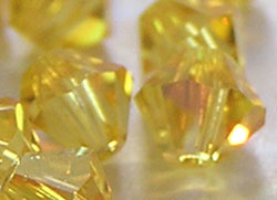  swarovski 5328 4mm light topaz ab bicone bead 