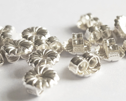  pair of sterling silver, stamped 925, 5mm x 3mm flower detail butterflies 