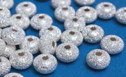  <18.8g/100> sterling silver 5.5mm x 3.5mm laser cut puffed circular disc spacer, 1.4mm hole 