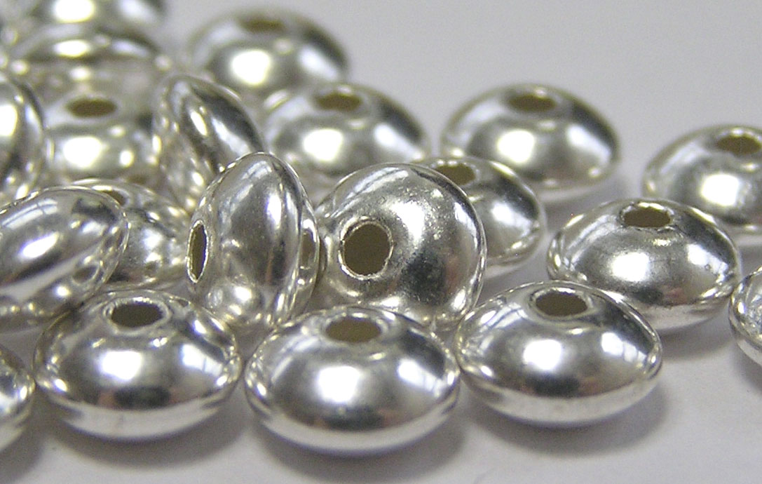  <19.85g/100> sterling silver 5.7mm x 3.2mm puffed circular disc spacer, 1.4mm hole 
