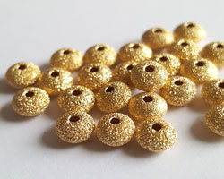  <18.55g/100> vermeil 5.5mm x 3.5mm laser cut puffed circular disc spacer, 1 micron plated for increased durability, 1.4mm hole [vermeil is gold plated sterling silver] 