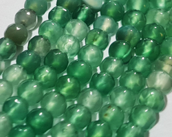  string of mostly green with a few browns agate faceted 4mm round beads - approx 90 per strand 