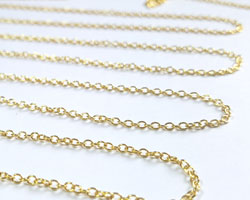  sold per cm : vermeil loose oval link chain -  links are 1.4mm long x 1mm high - 18 links per inch takes a 0.64mm ring [vermeil is gold plated sterling silver] 