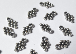  sterling silver small 7.5mm dangle leaf charm with integral closed loop which has a 1mm hole 