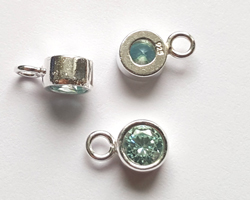  ** NEW LOWER PRICE ** sterling silver, stamped 925, 8.35mm x 5.15mm drop / charm containing a 4mm ice blue cubic zironia, very nicely made, has closed jumpring attached at the top with internal diameter of 1.5mm 