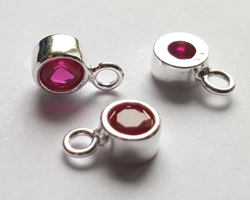  ** NEW LOWER PRICE ** sterling silver, stamped 925, 8.35mm x 5.15mm drop / charm containing a 4mm fuchsia dark pink cubic zironia, very nicely made, has closed jumpring attached at the top with internal diameter of 1.5mm 