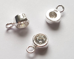  ** NEW LOWER PRICE ** sterling silver, stamped 925, 8.35mm x 5.15mm drop / charm containing a 4mm crystal clear cubic zironia, very nicely made, has closed jumpring attached at the top with internal diameter of 1.5mm 