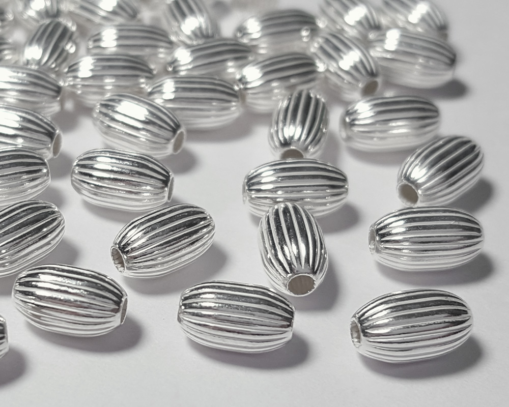 <32.3g/100> sterling silver 8.25mm x 4.8mm corrugated oval bead, 2mm hole