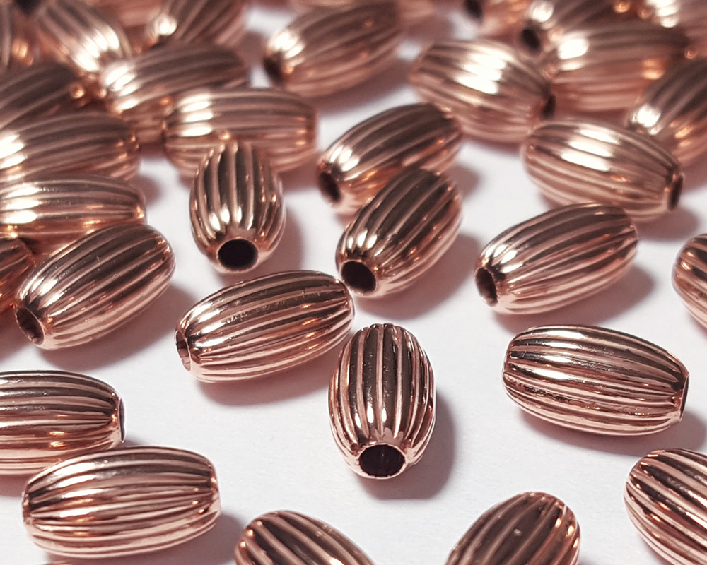  <18.1g/100> ROSE VERMEIL 6.7mm x 4mm corrugated oval bead, 1.5mm hole, 1 micron plated for increased durability [vermeil is gold plated sterling silver] 